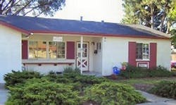 Single-story house with red shutters and a small porch