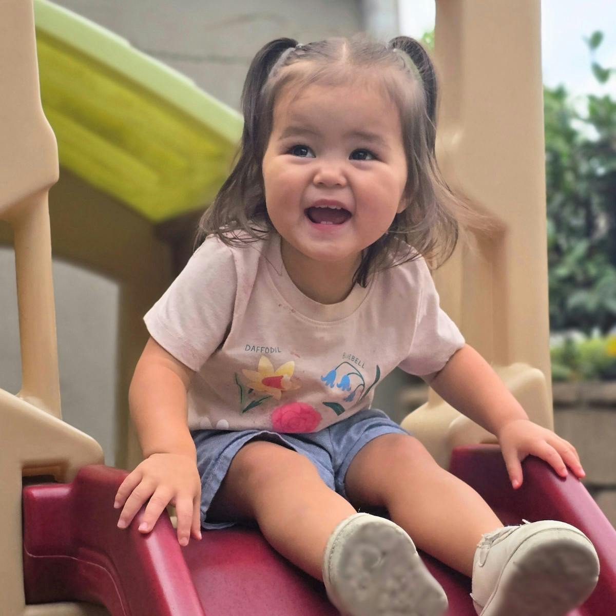 Child on a playground slide
