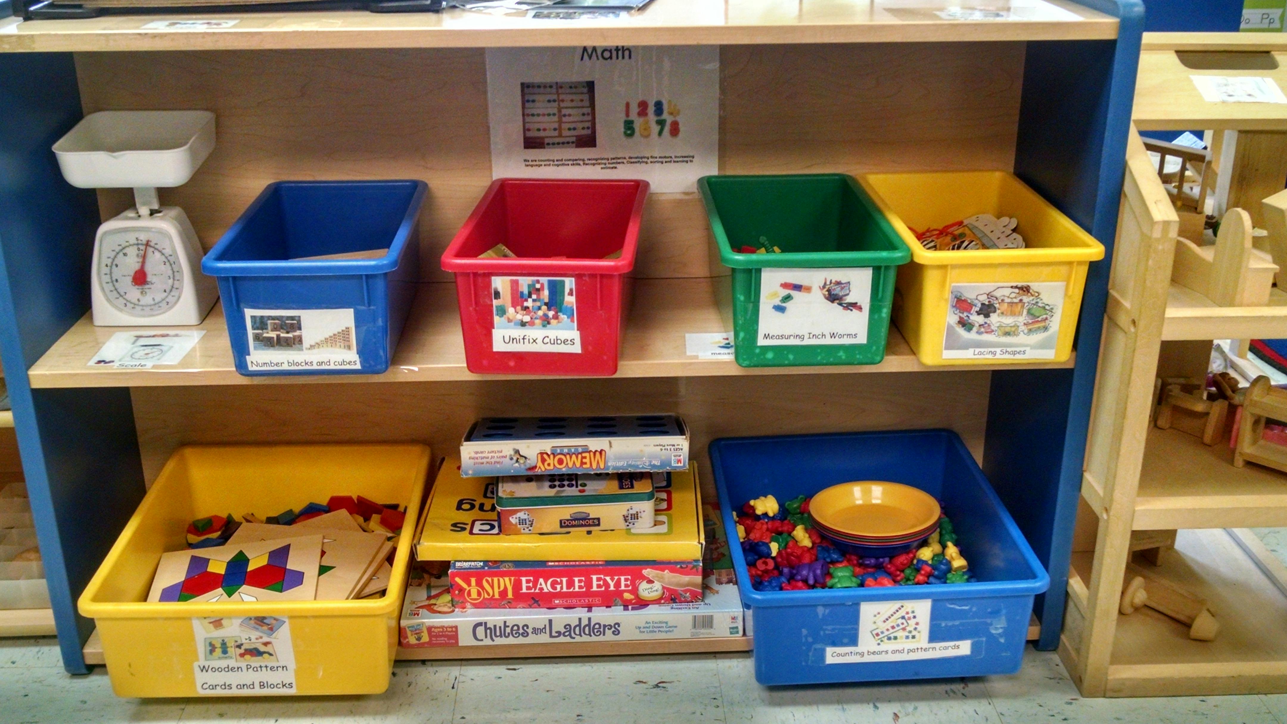 Shelves with colorful bins containing various items