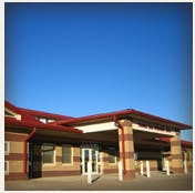 Building with a red roof and brick facade