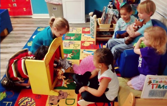 Children playing with toys in a classroom