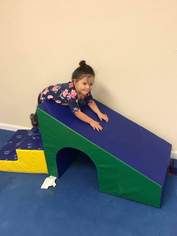 Child on a soft play ramp