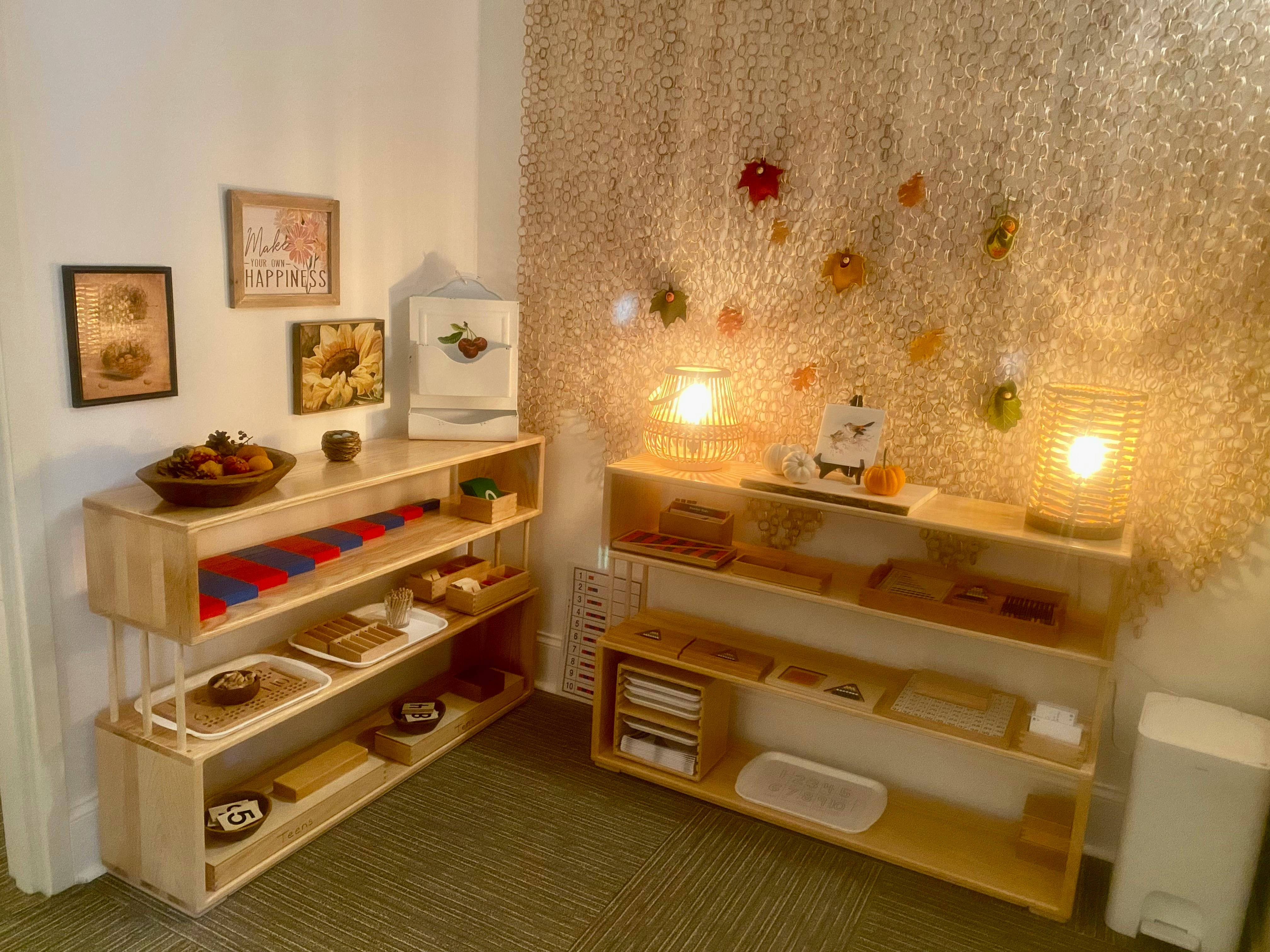 Two wooden shelving units with various items in a classroom