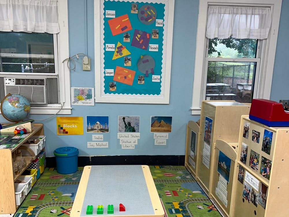 Classroom with world monuments display and children's craft board