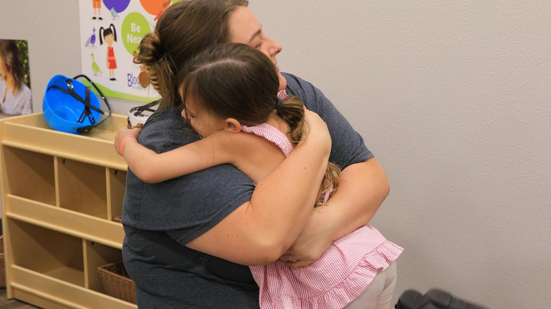 Person hugging a child