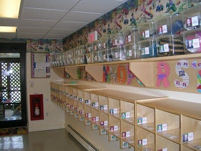 Classroom with cubbies and clear bins on-shelf storage bins
