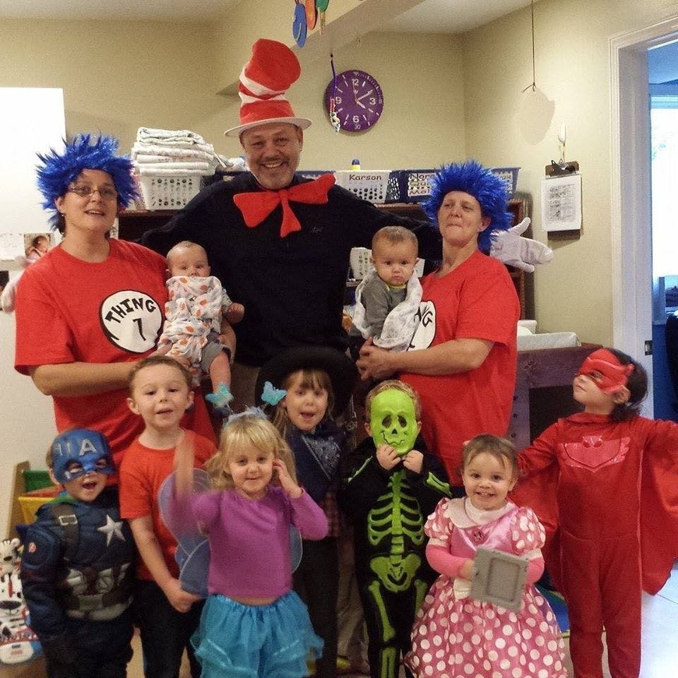 People and children in various costumes, including Cat in the Hat and Thing 1
