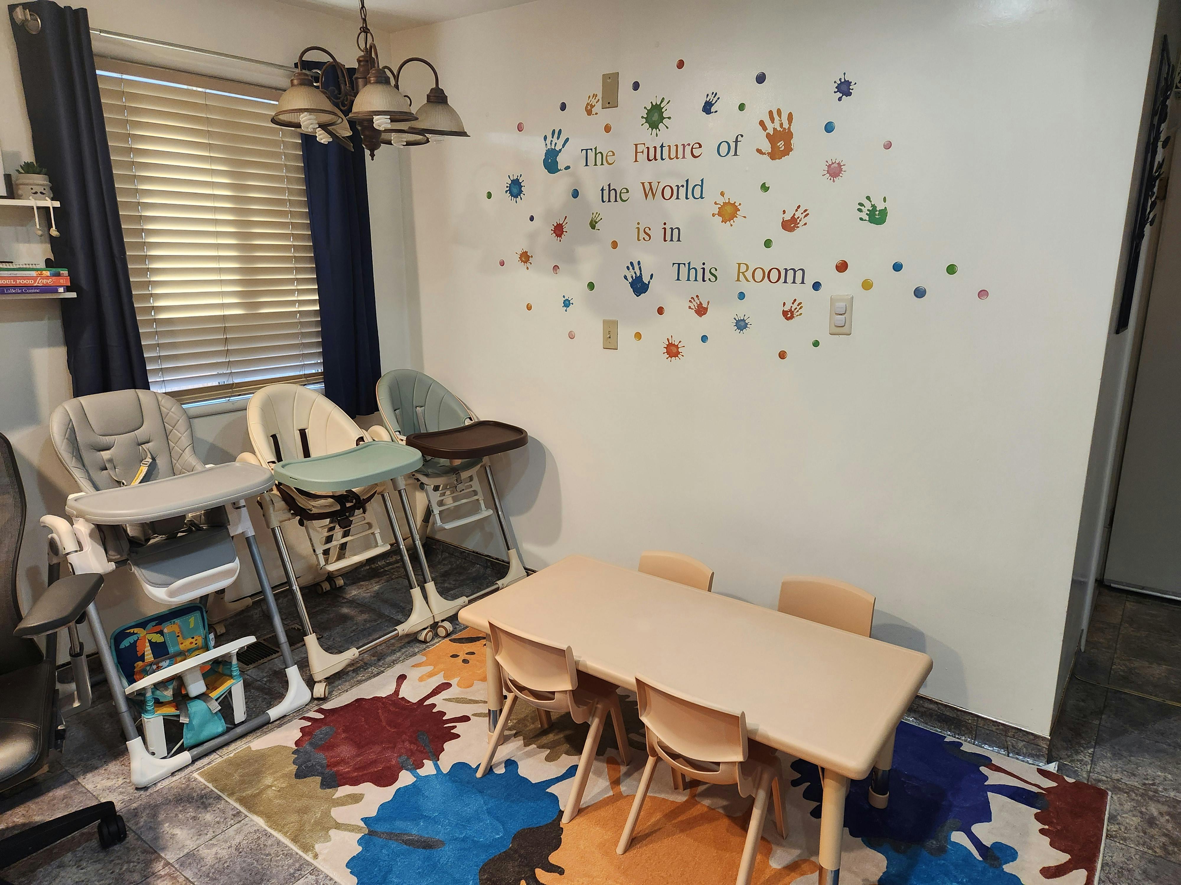 High chairs and a small table with chairs in a room