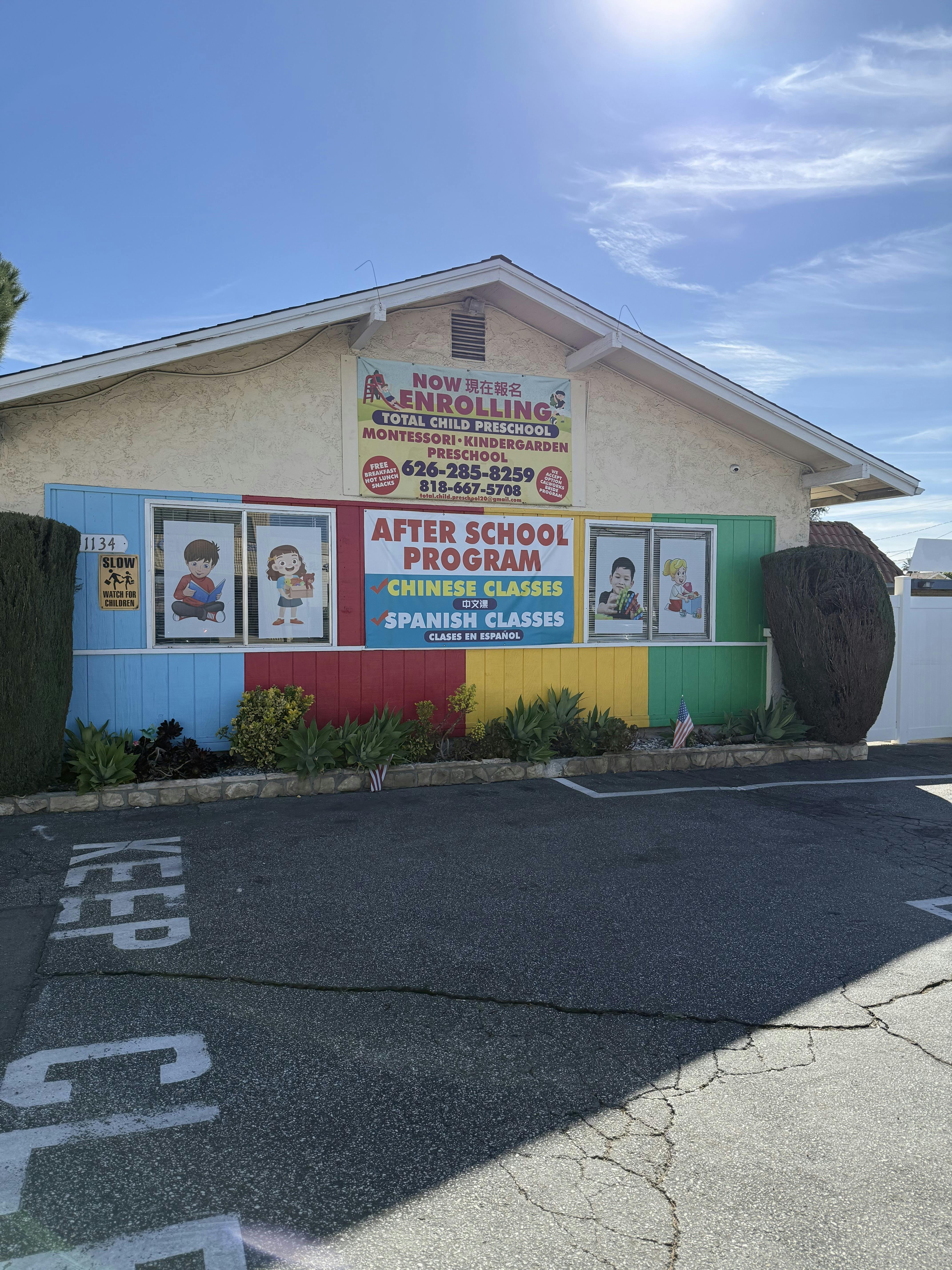 A building with colorful panels and signs for a preschool and after-school program