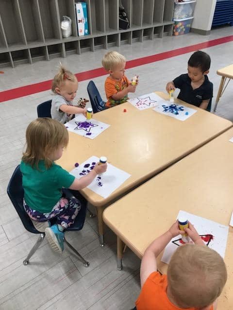 Children at a table doing an art activity