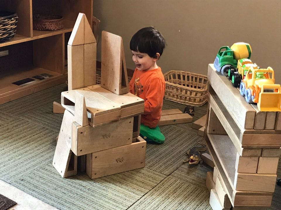 Child playing with wooden blocks