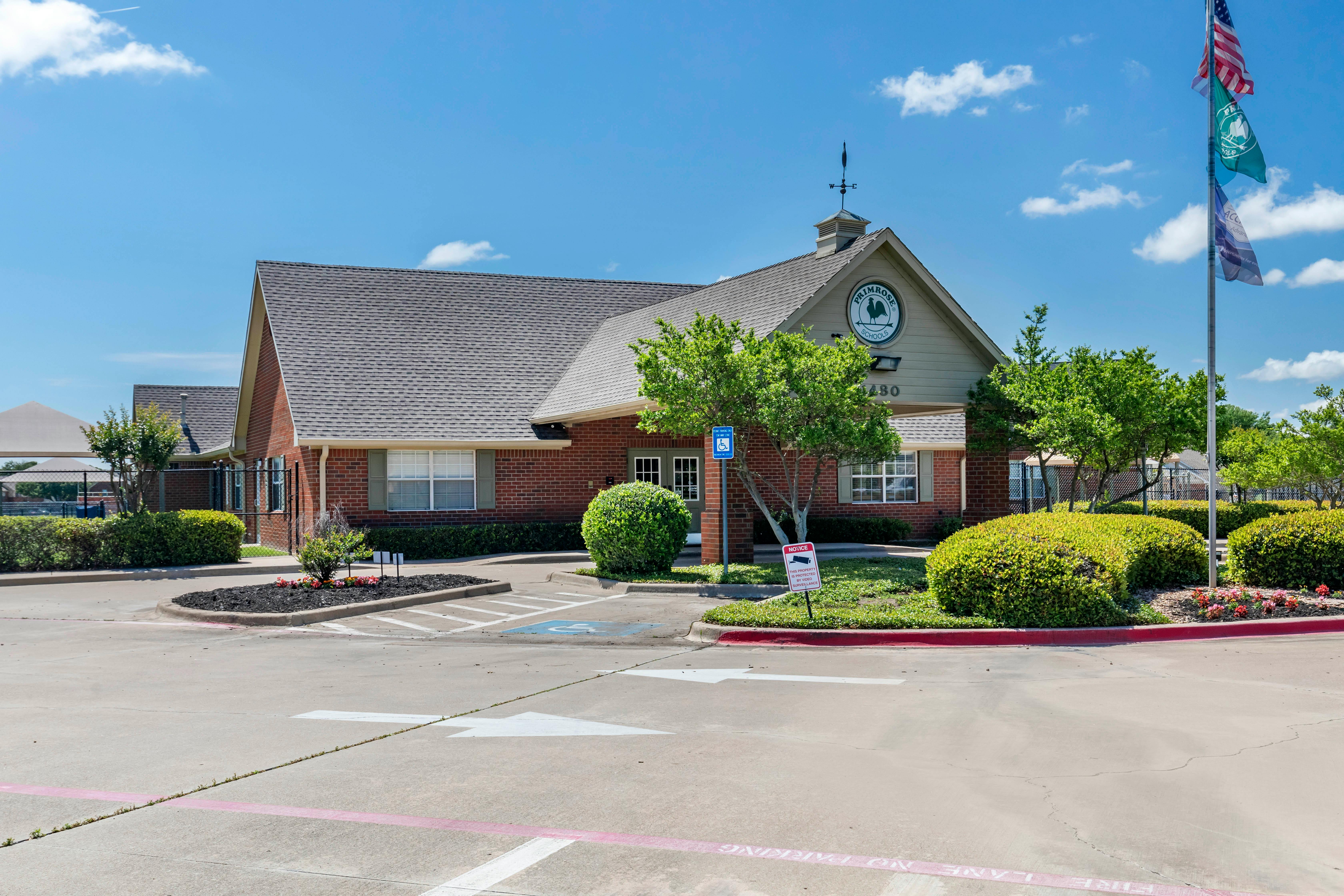 Brick building with a sign that says Primrose Schools
