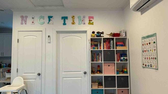 Decorative letters spelling "NICE TIME" above two doors