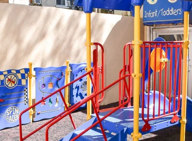 Playground structure with blue and red elements