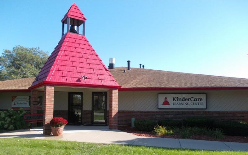 KinderCare Learning Center building with red roof bell tower