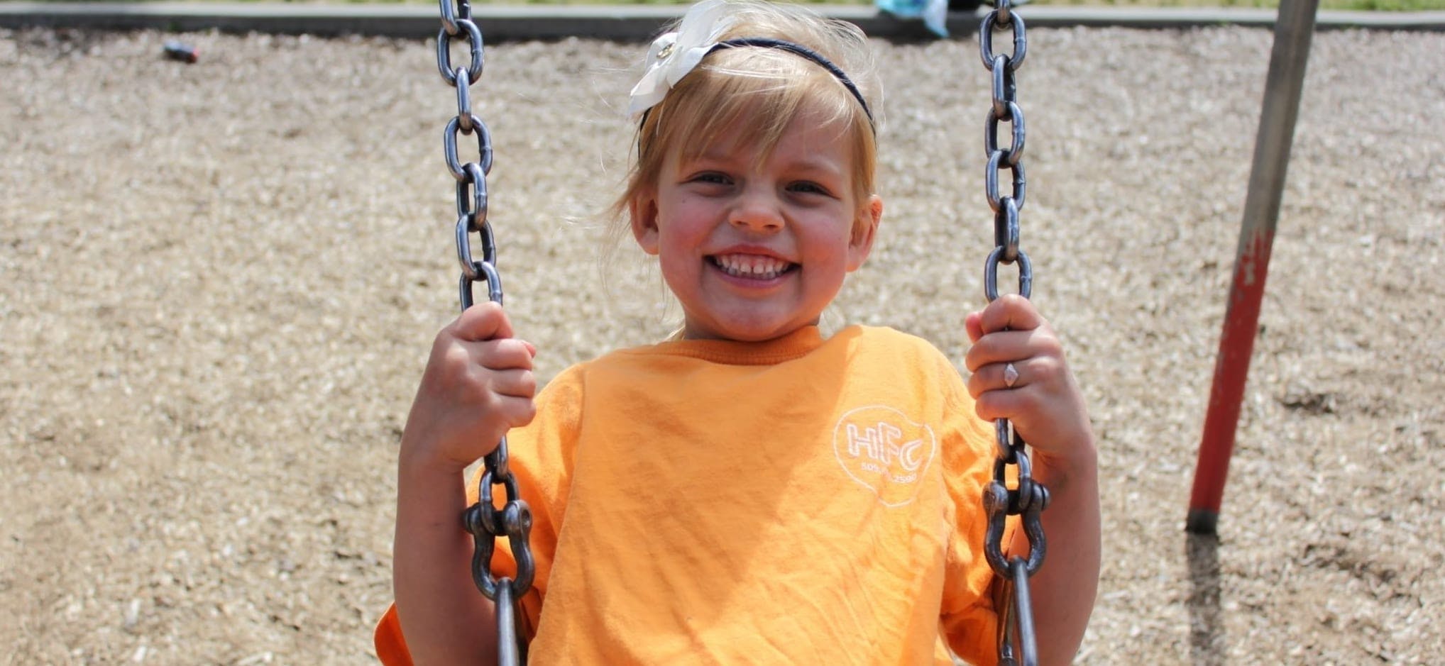 Child on a swing at a playground