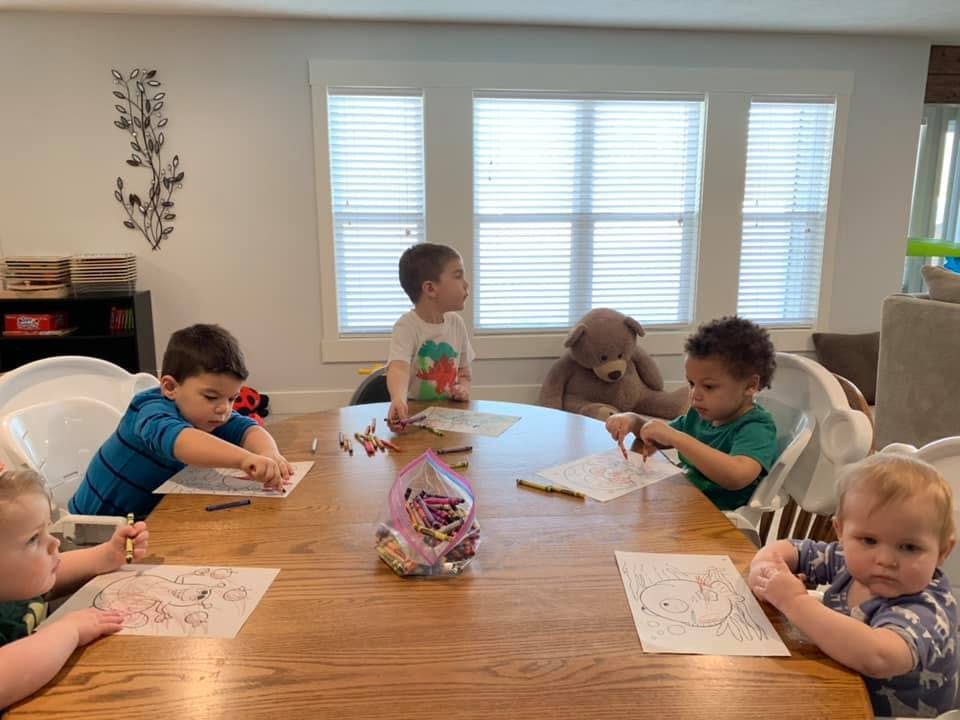 Children drawing at a table