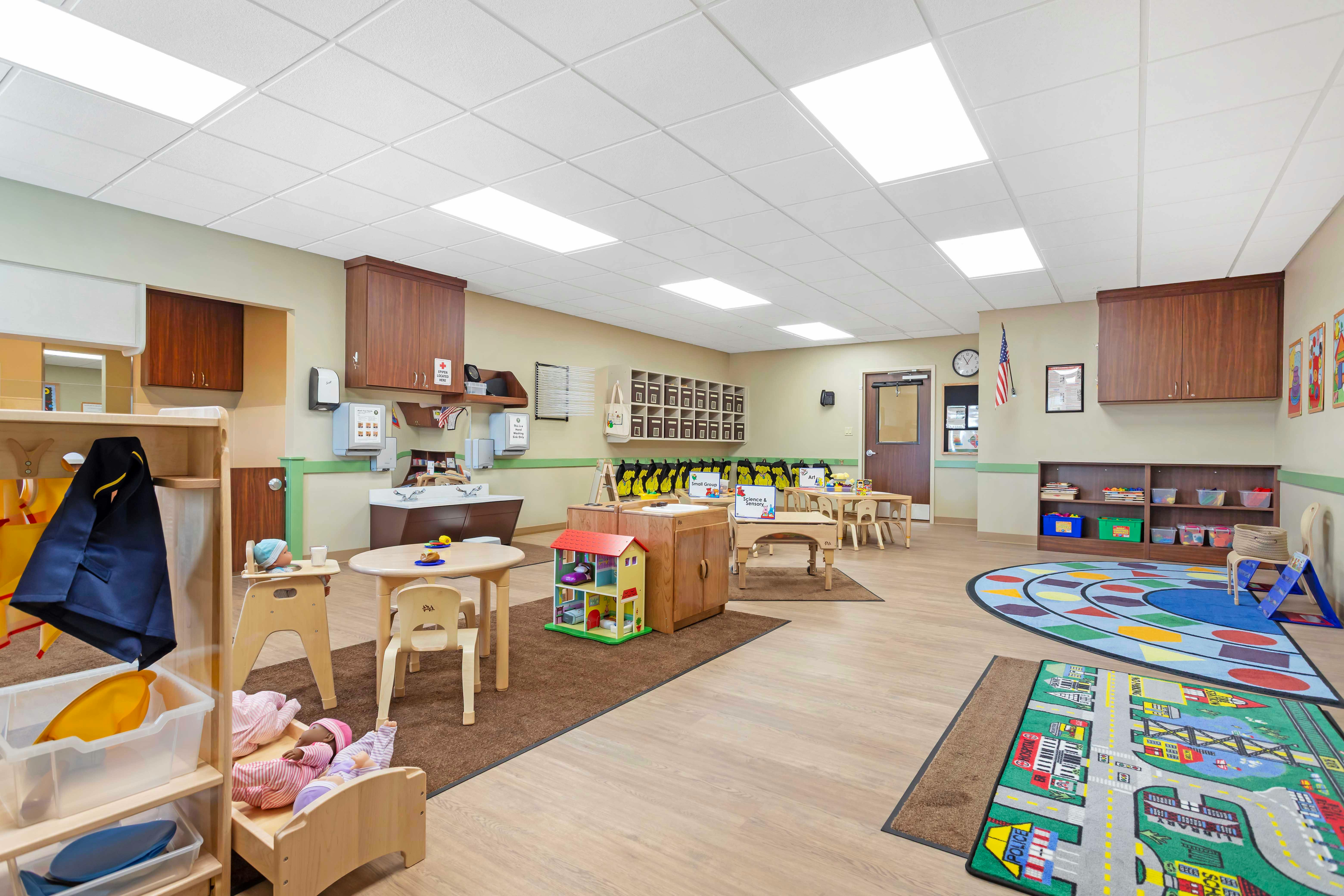 An empty early childhood classroom with multiple learning stations