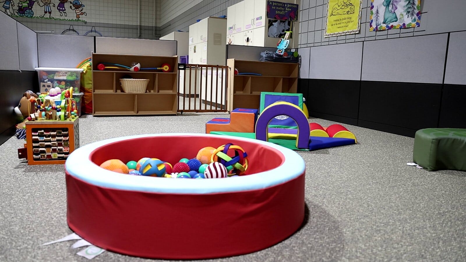 Indoor play area with a red ball pit and soft play equipment