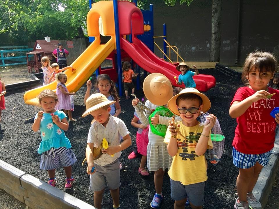 Children playing on a playground with slides