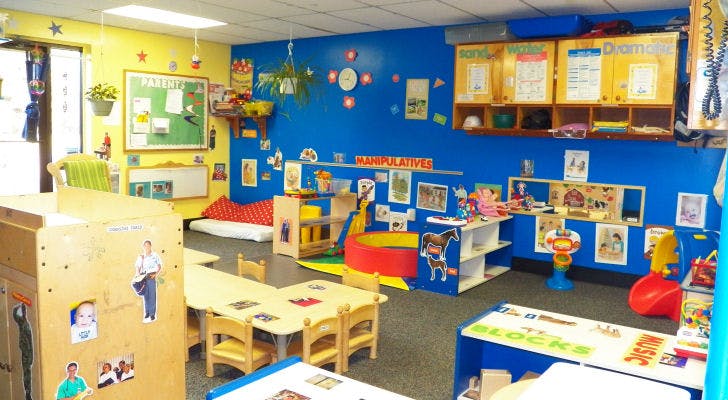 Colorful classroom with small tables and chairs