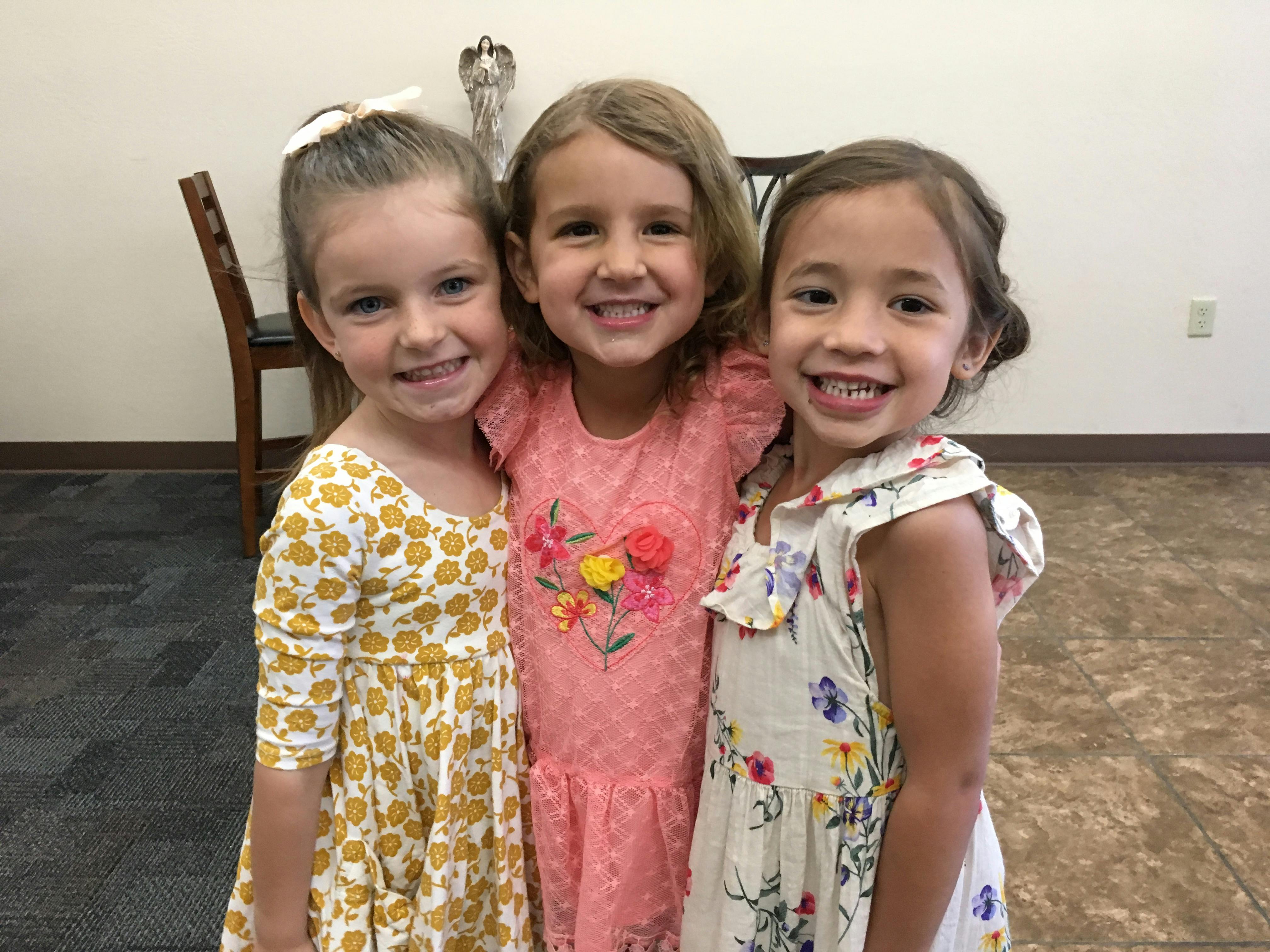 Three children standing together