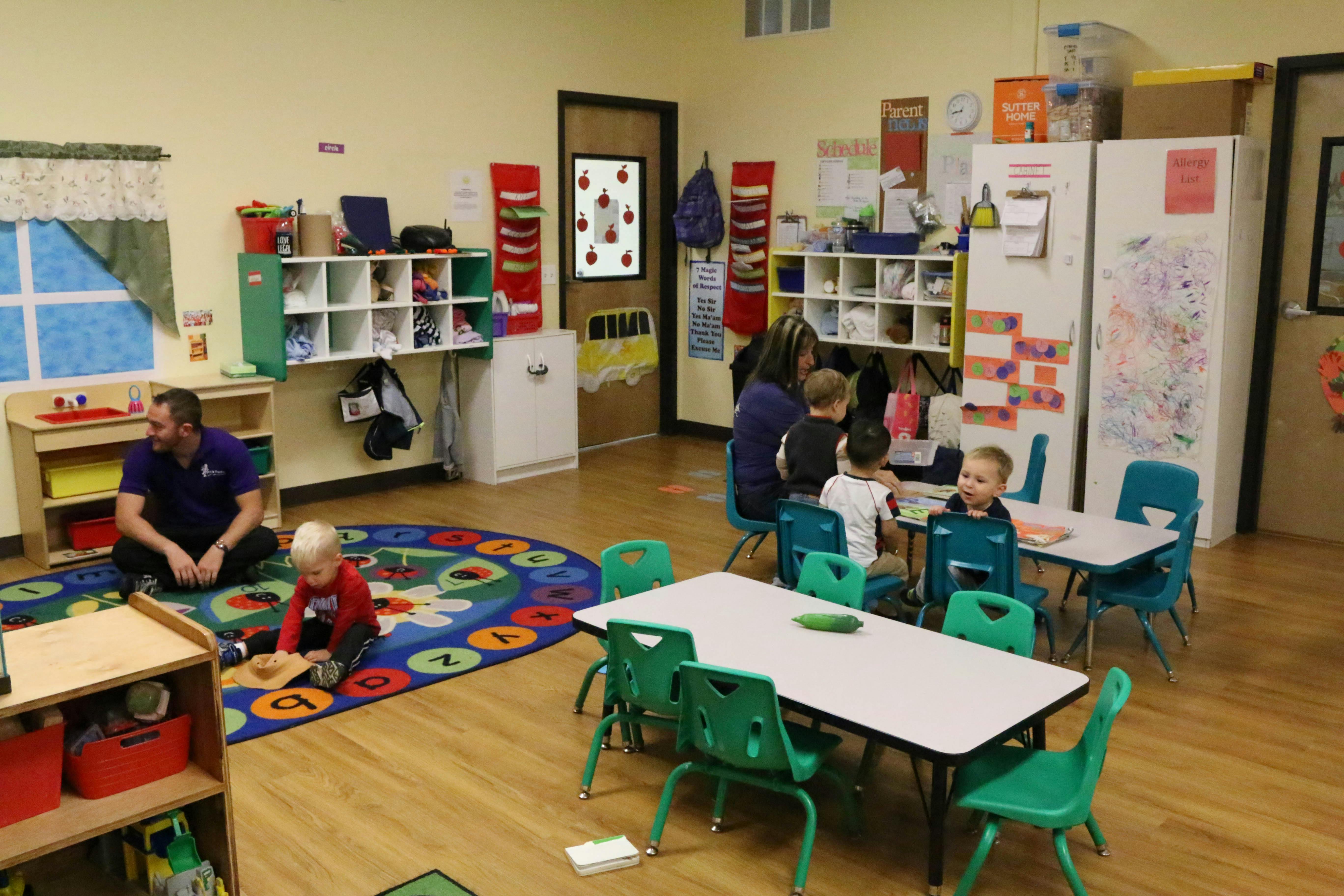 Adult and children in a classroom