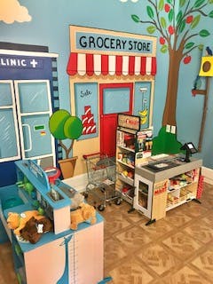 Play grocery store with shopping cart and checkout counter