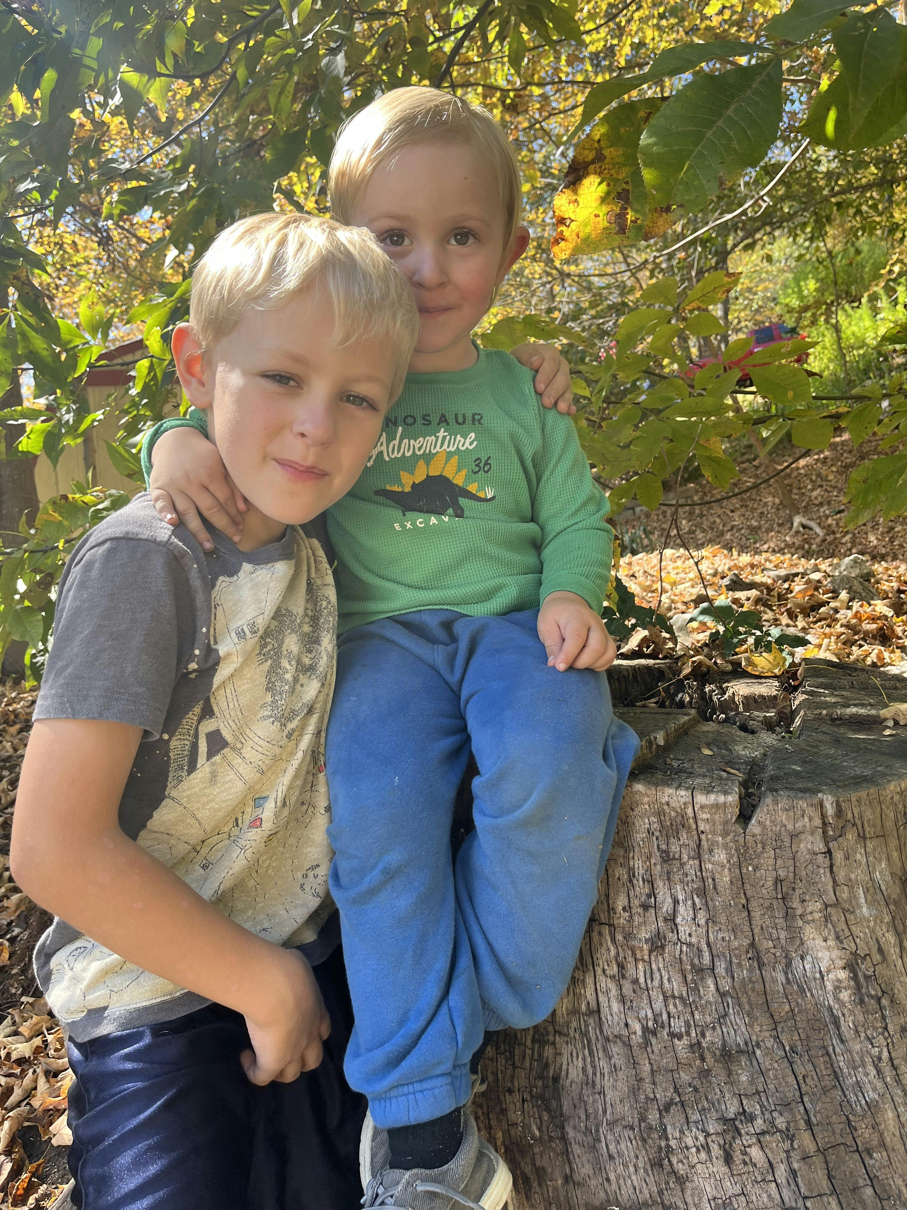 Two children posing together outdoors