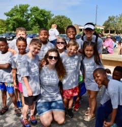 Group of children and adults posing outdoors