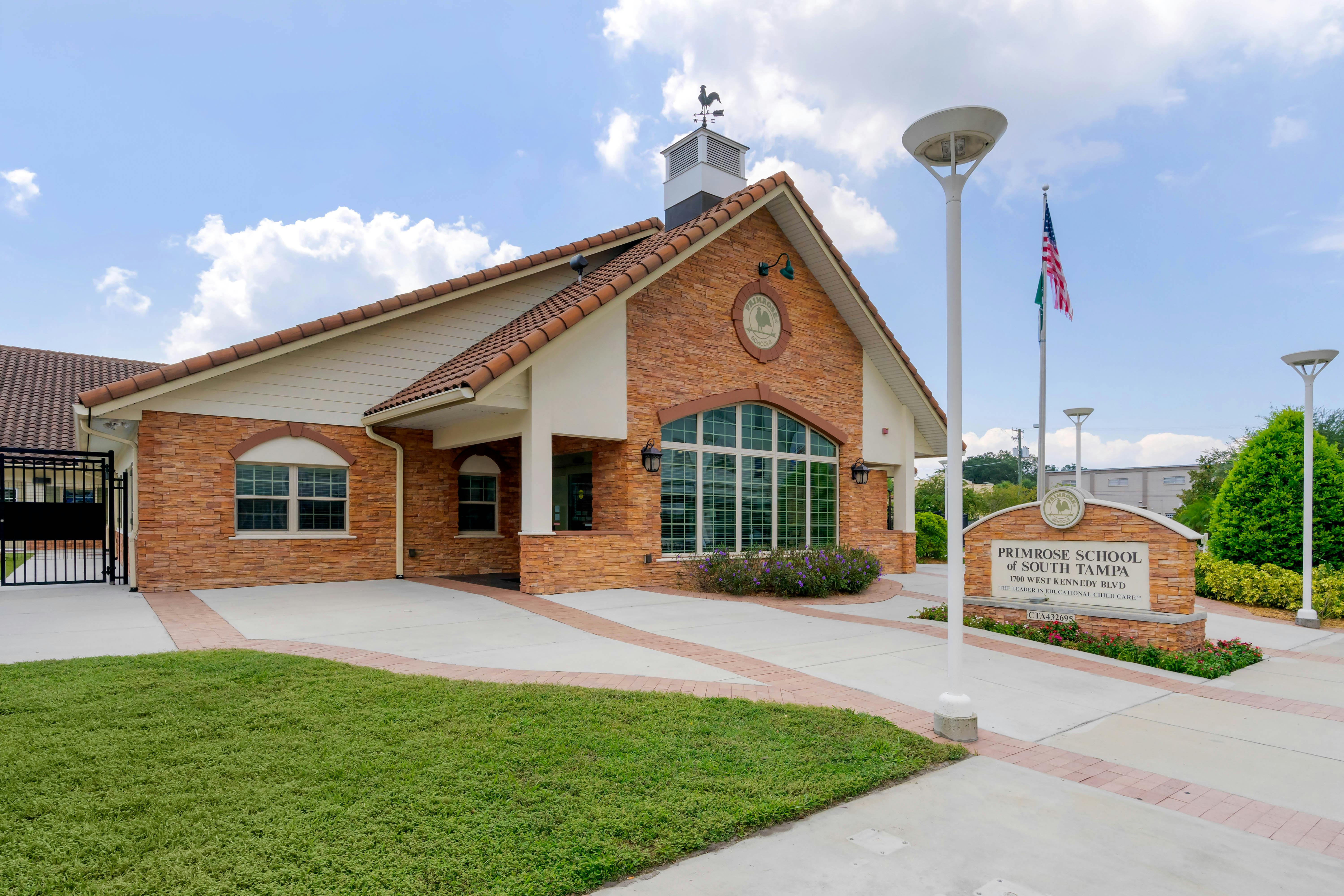 Primrose School of South Tampa building exterior with sign and flagpole