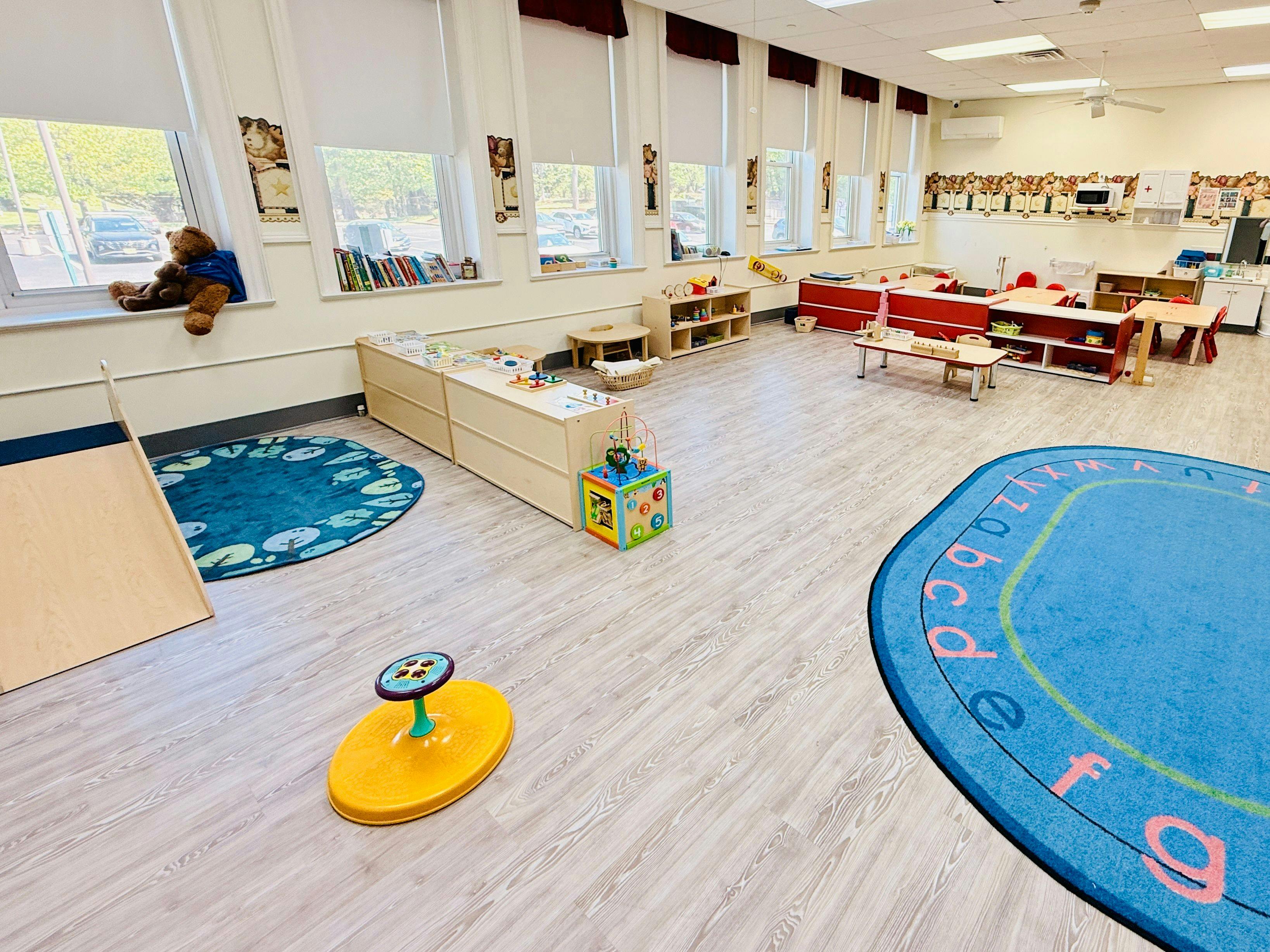 Classroom with child-sized furniture and play areas