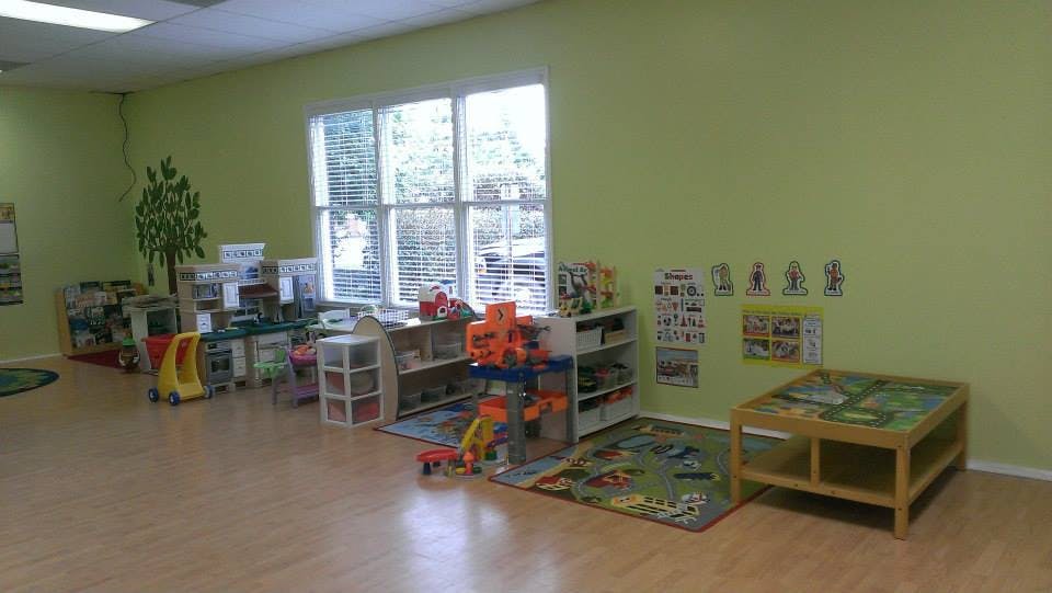 Classroom with toys, shelves, and a window