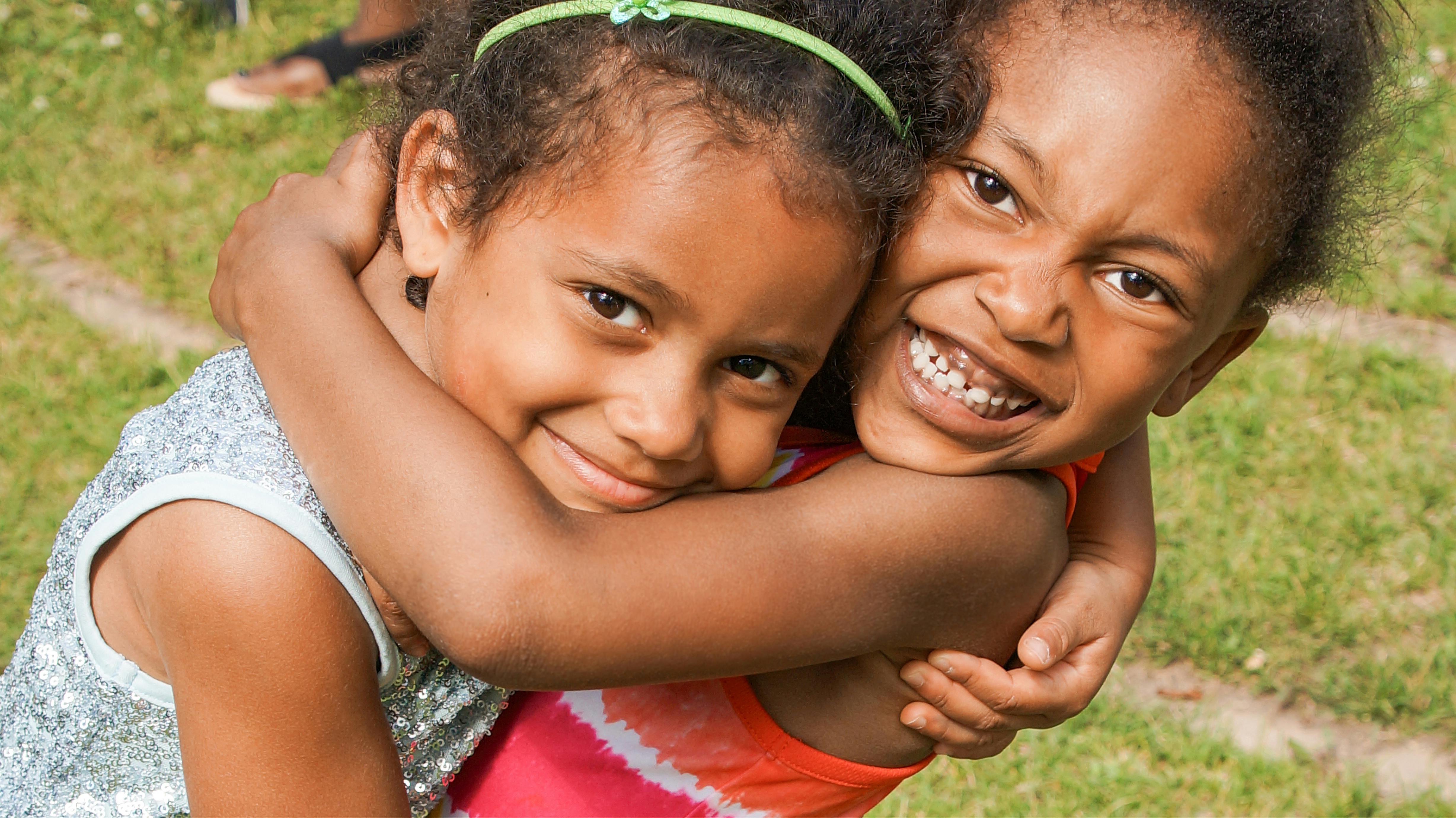 Two children hugging