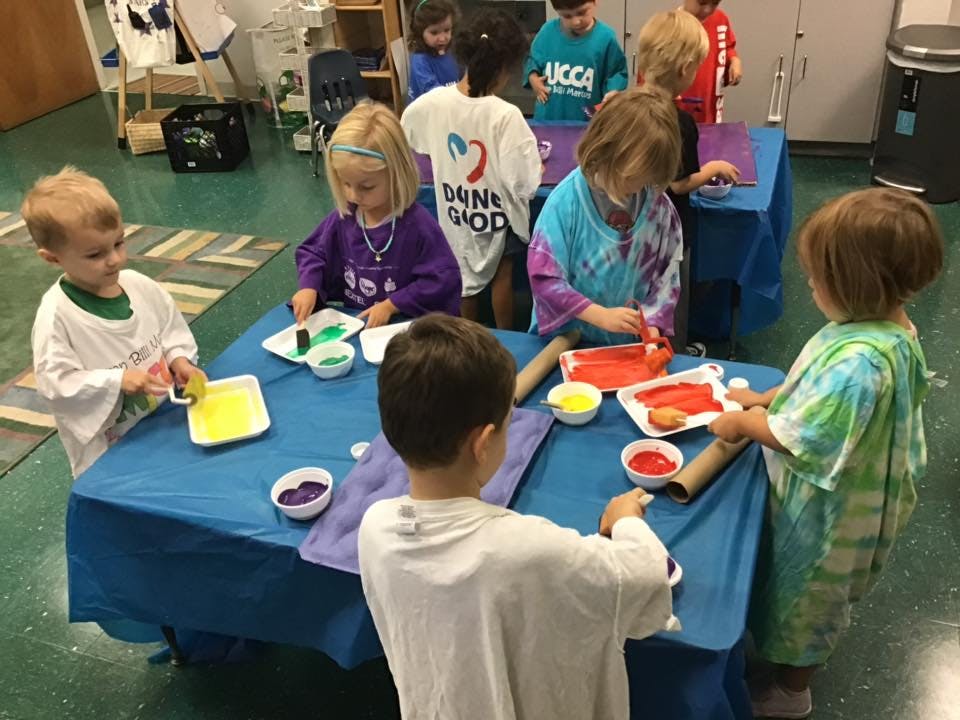 Children painting at a table
