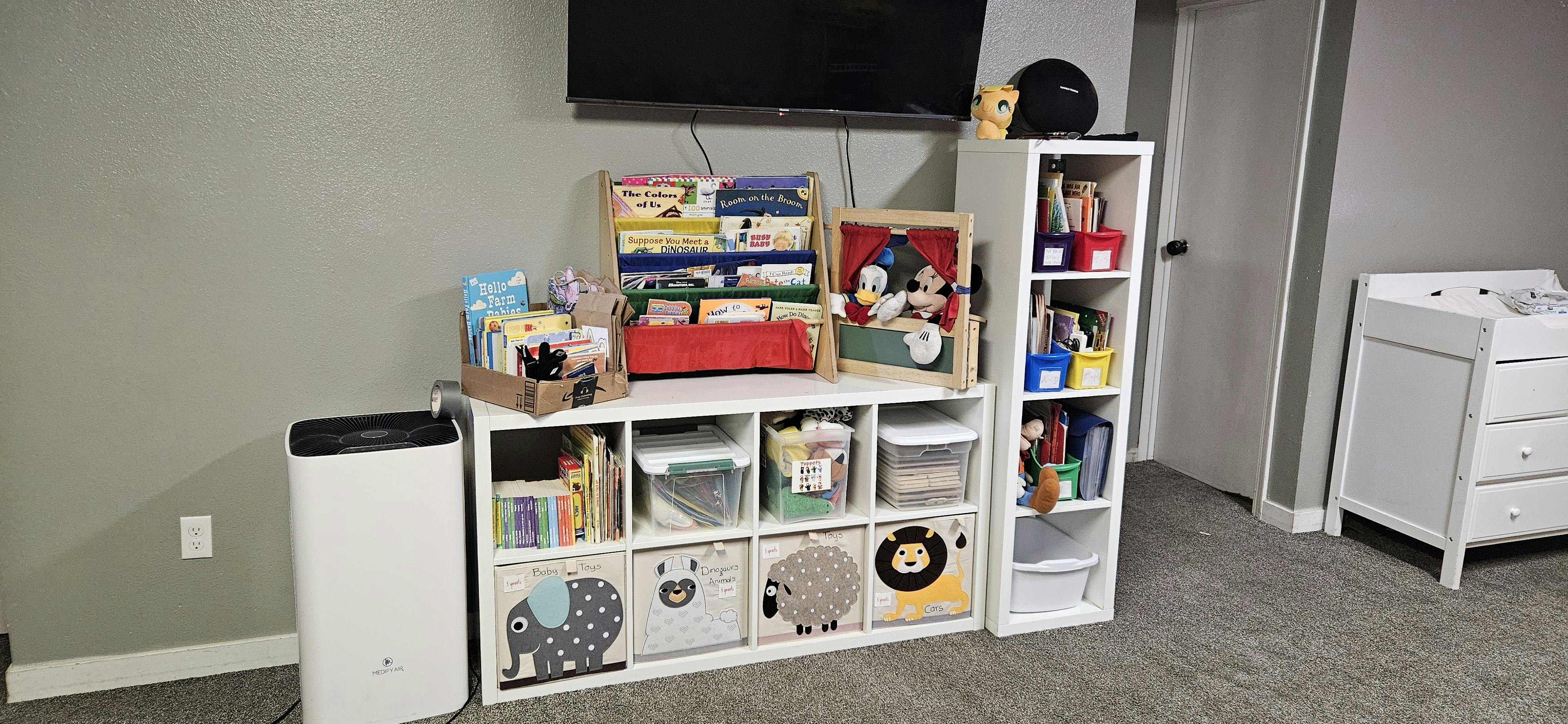 Storage unit with cubbies and shelves filled with various items