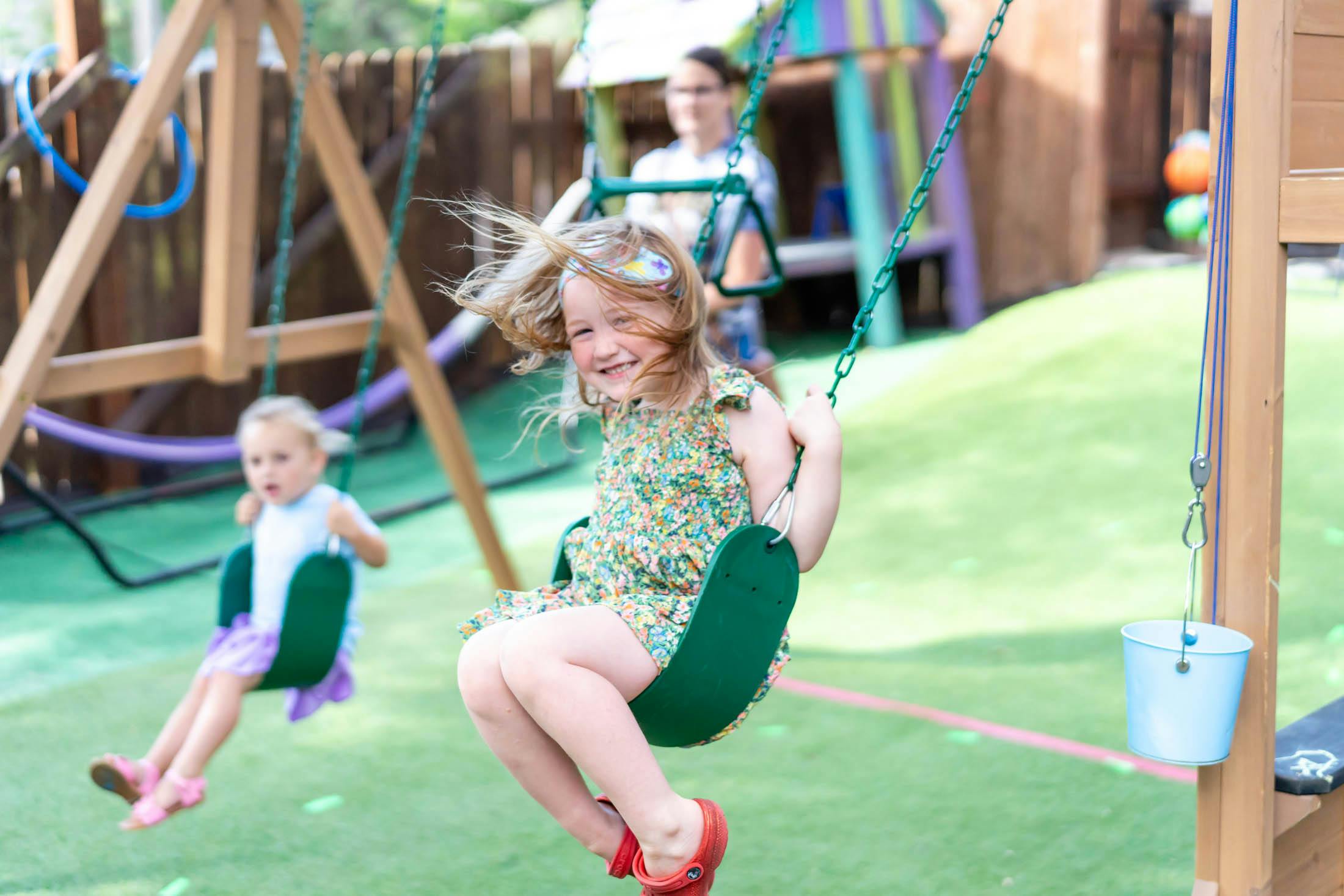 Child swinging on a playground swing