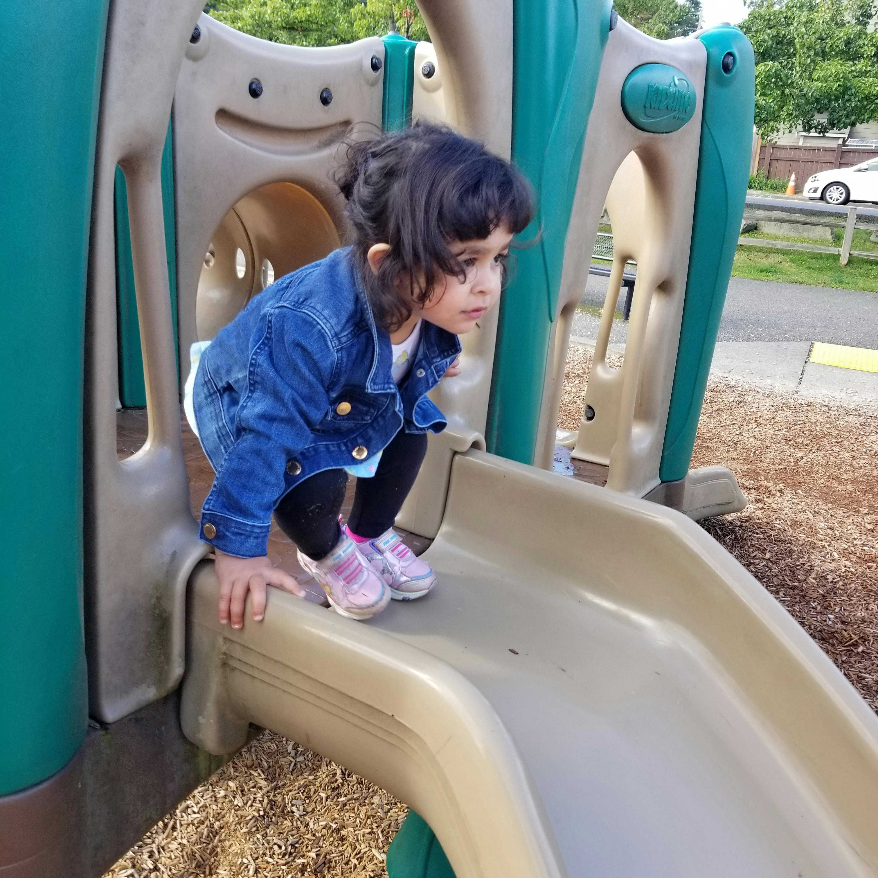 Child on a playground slide