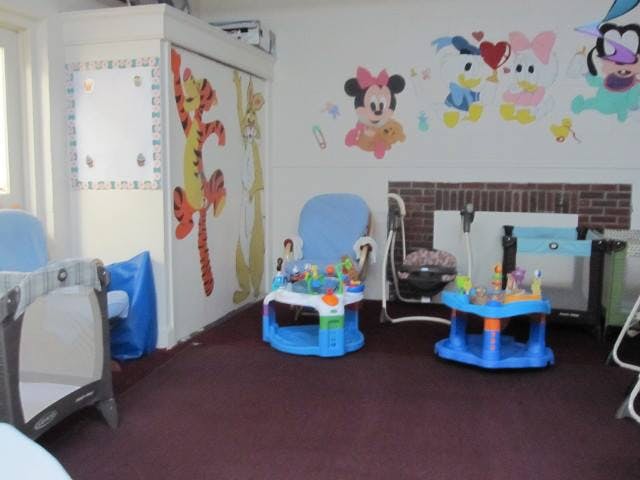 Playroom with baby chairs and wall decals