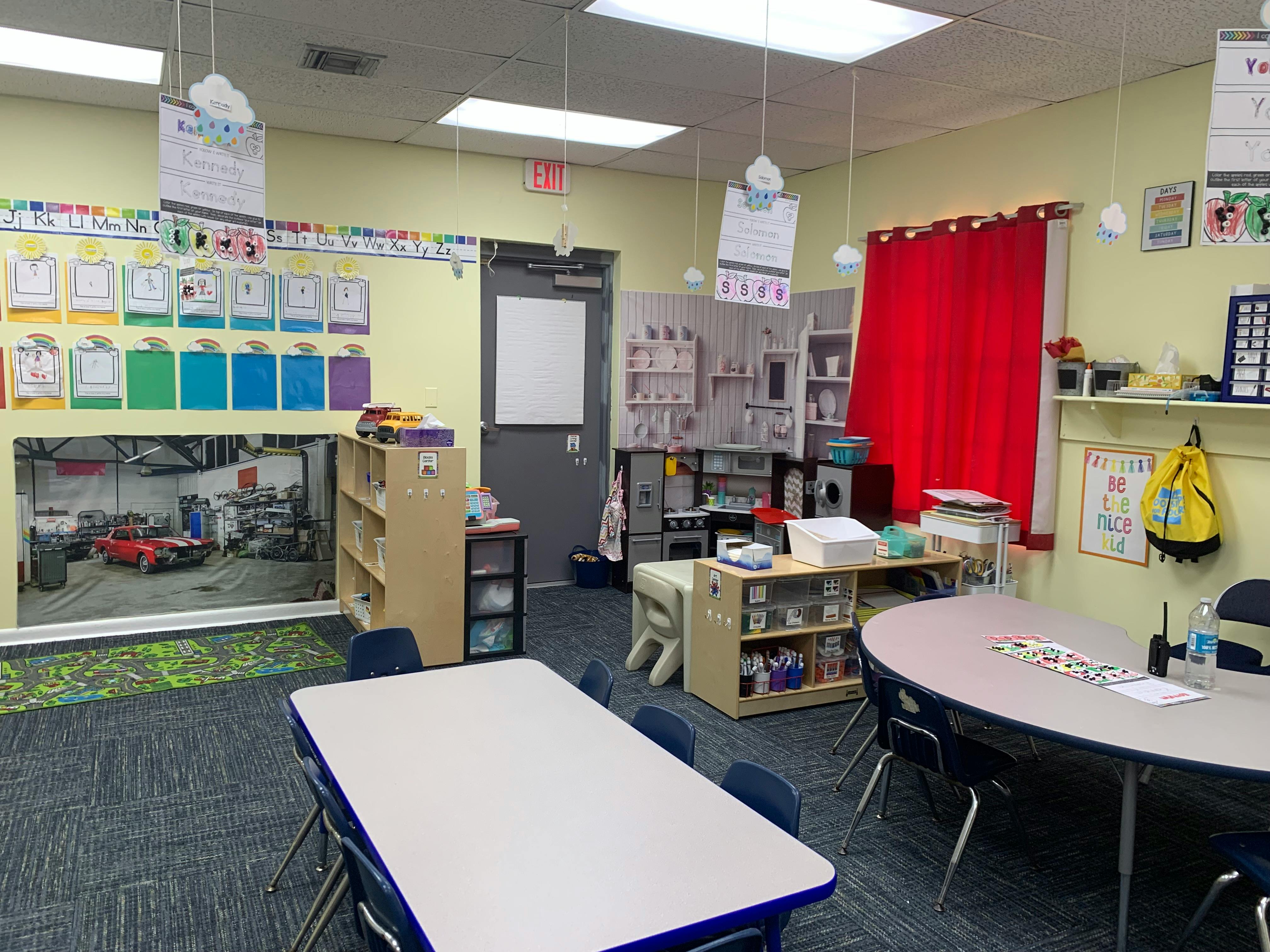 Classroom with tables, chairs, and learning materials
