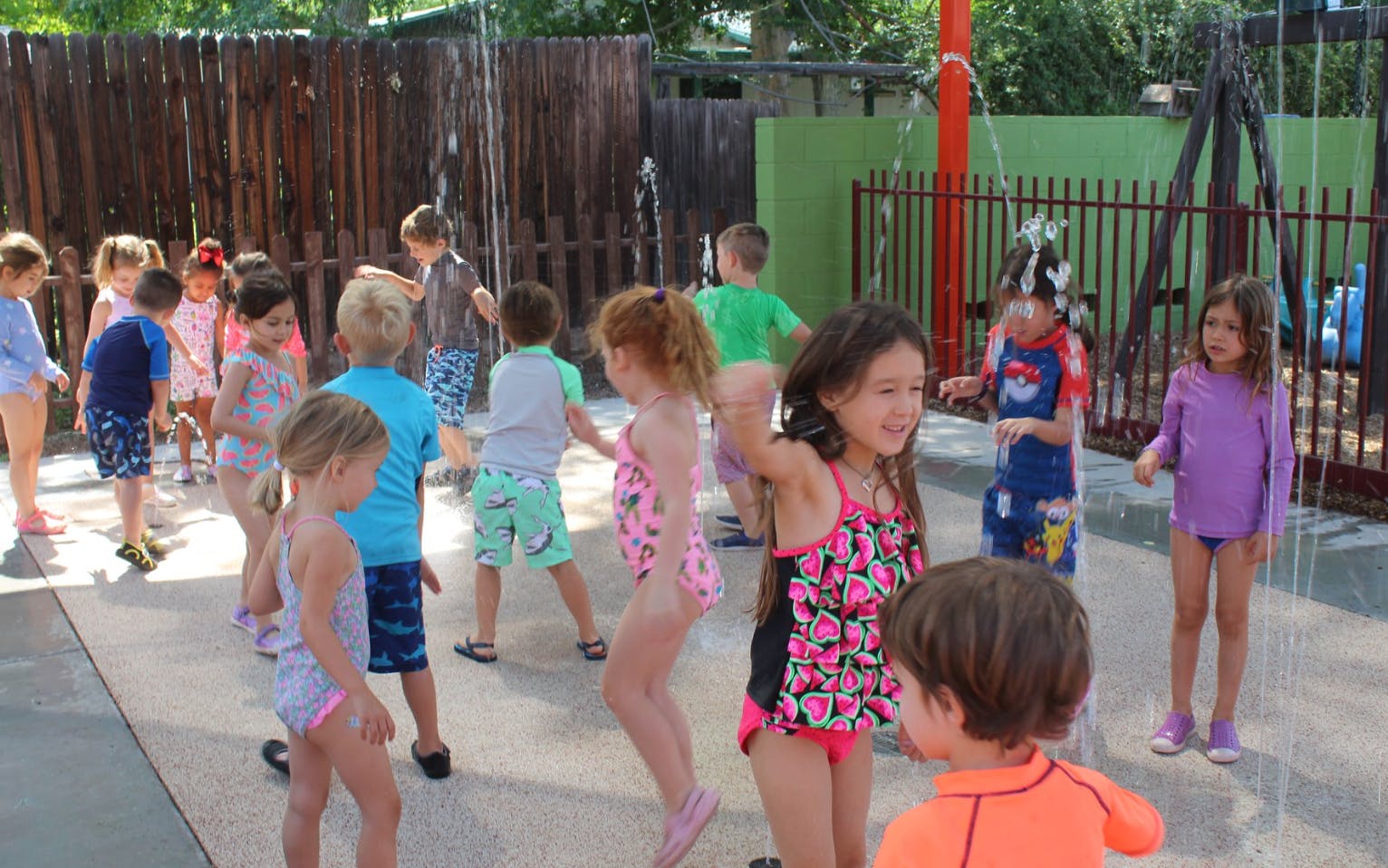 Children playing in water at a splash pad