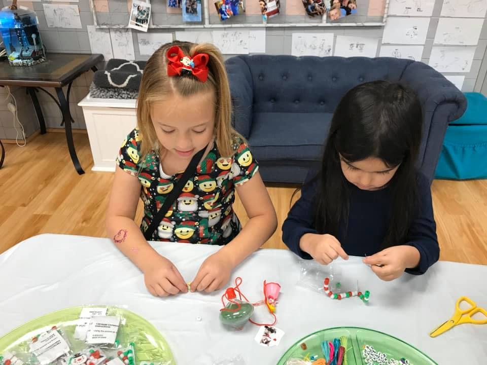 Two children making crafts at a table