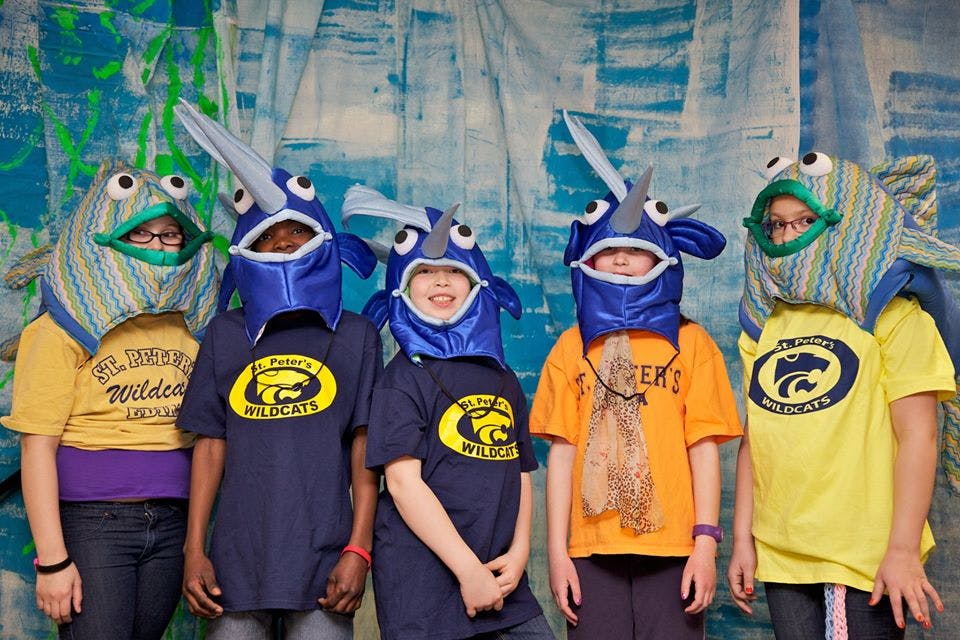 Five children in fish and narwhal costumes