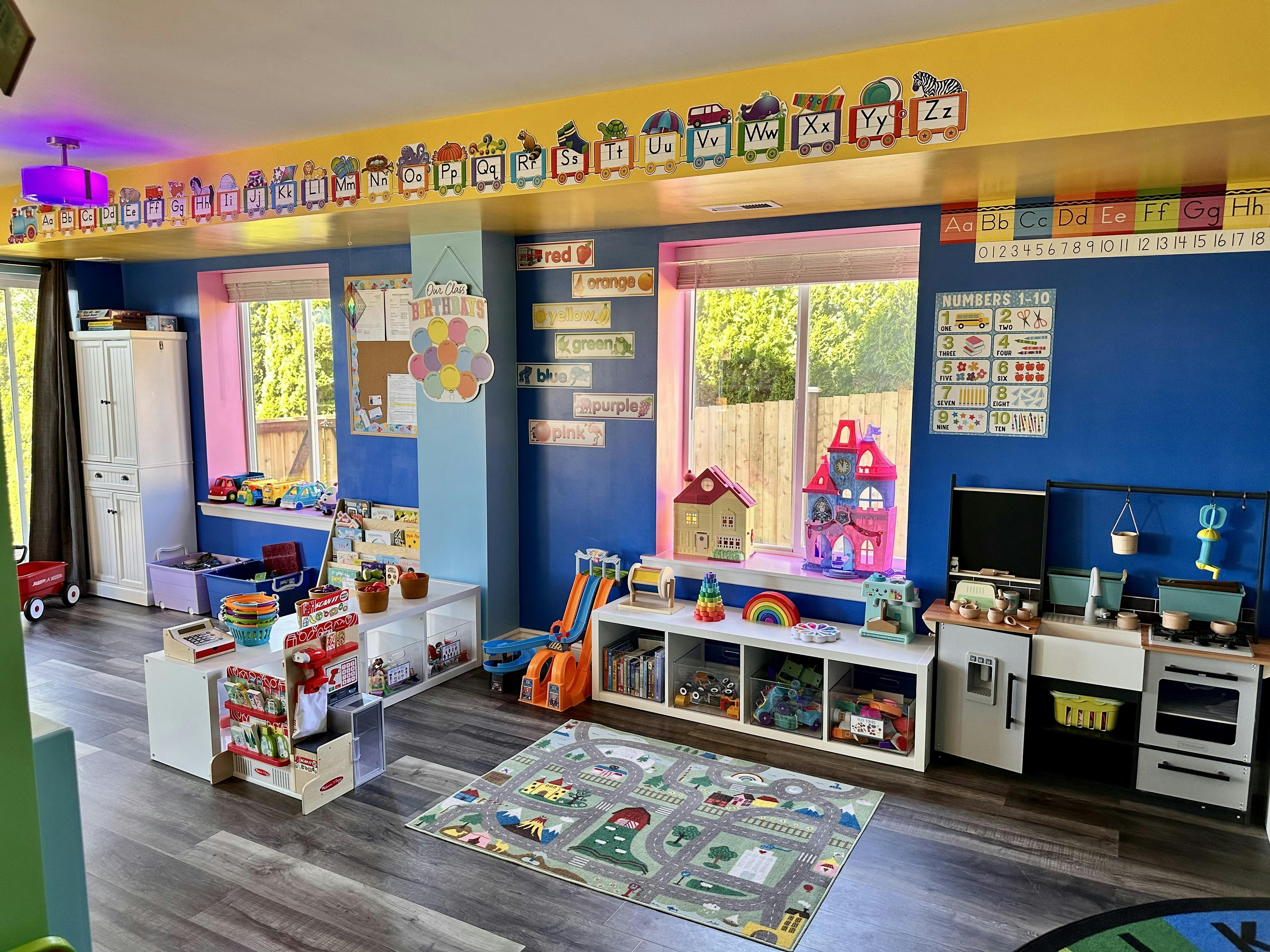 Playroom with toys, shelves, and a play kitchen