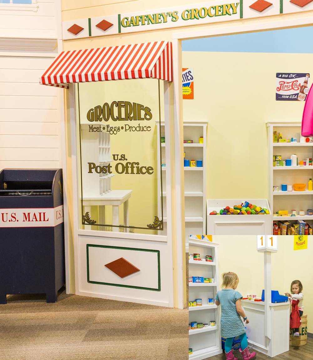 Two children playing in a pretend grocery store