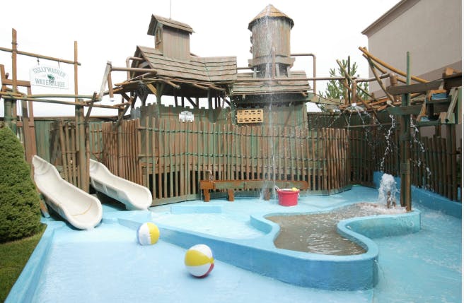 Water park play area with slides and water features