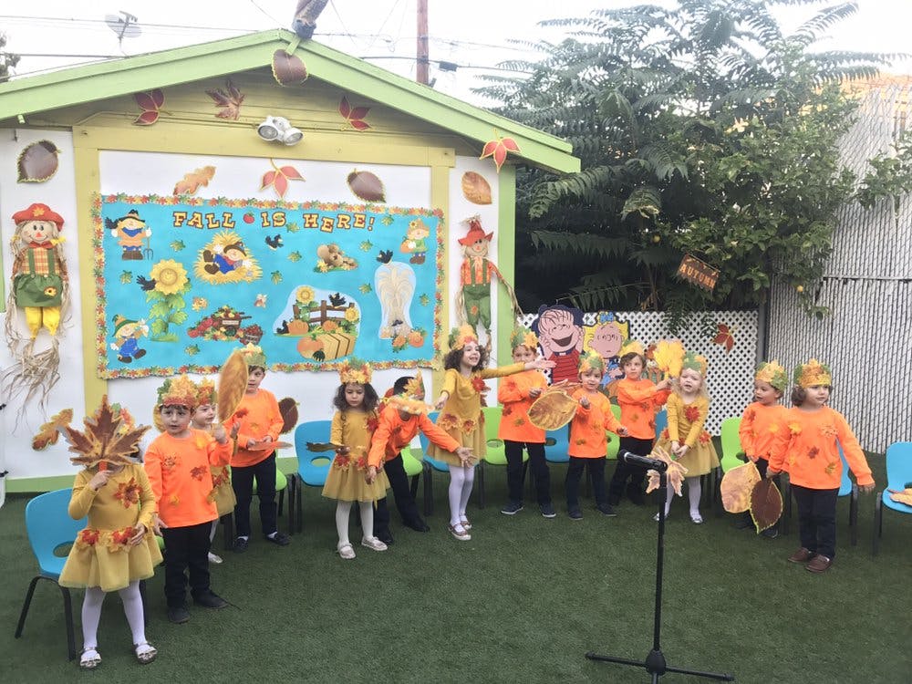 Children in costumes performing outdoors