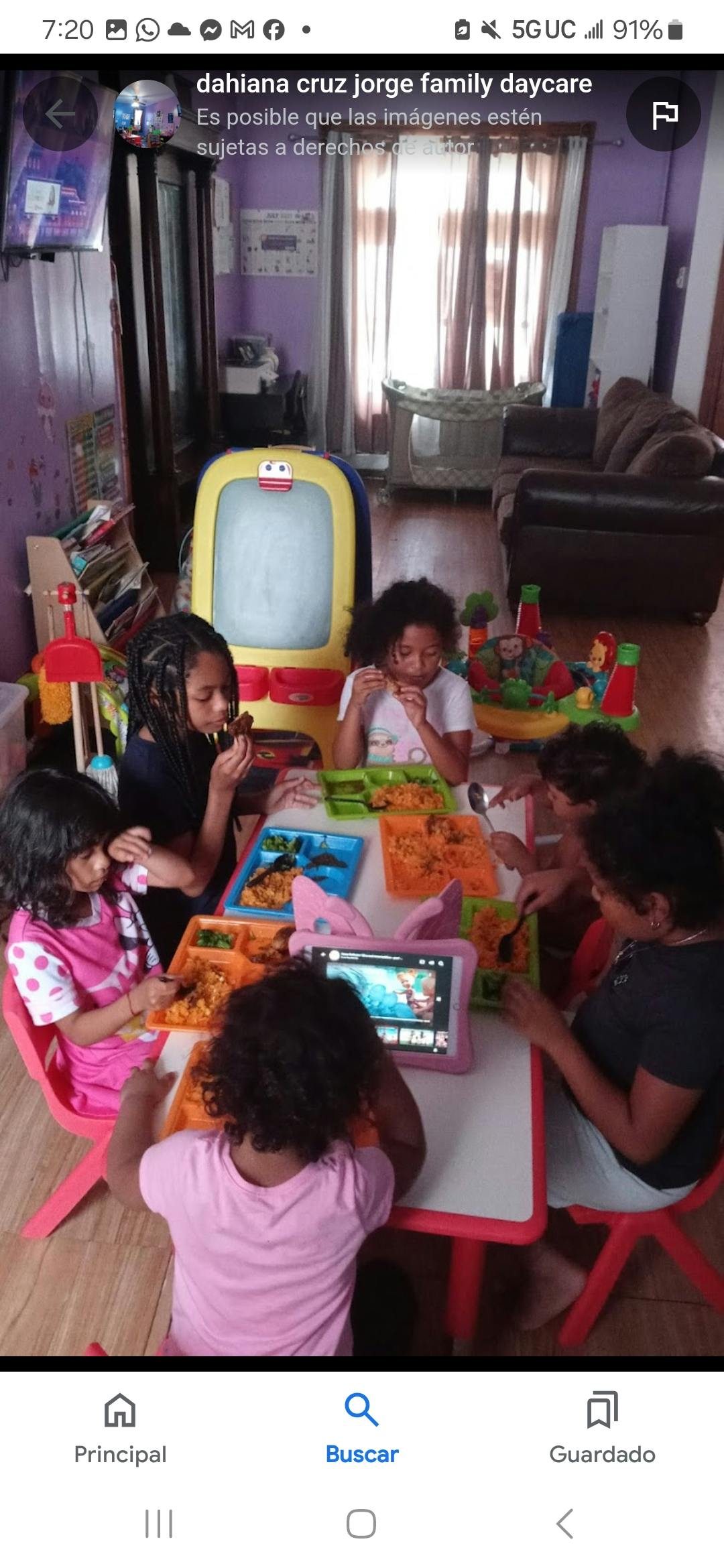 Children eating at a table with food trays