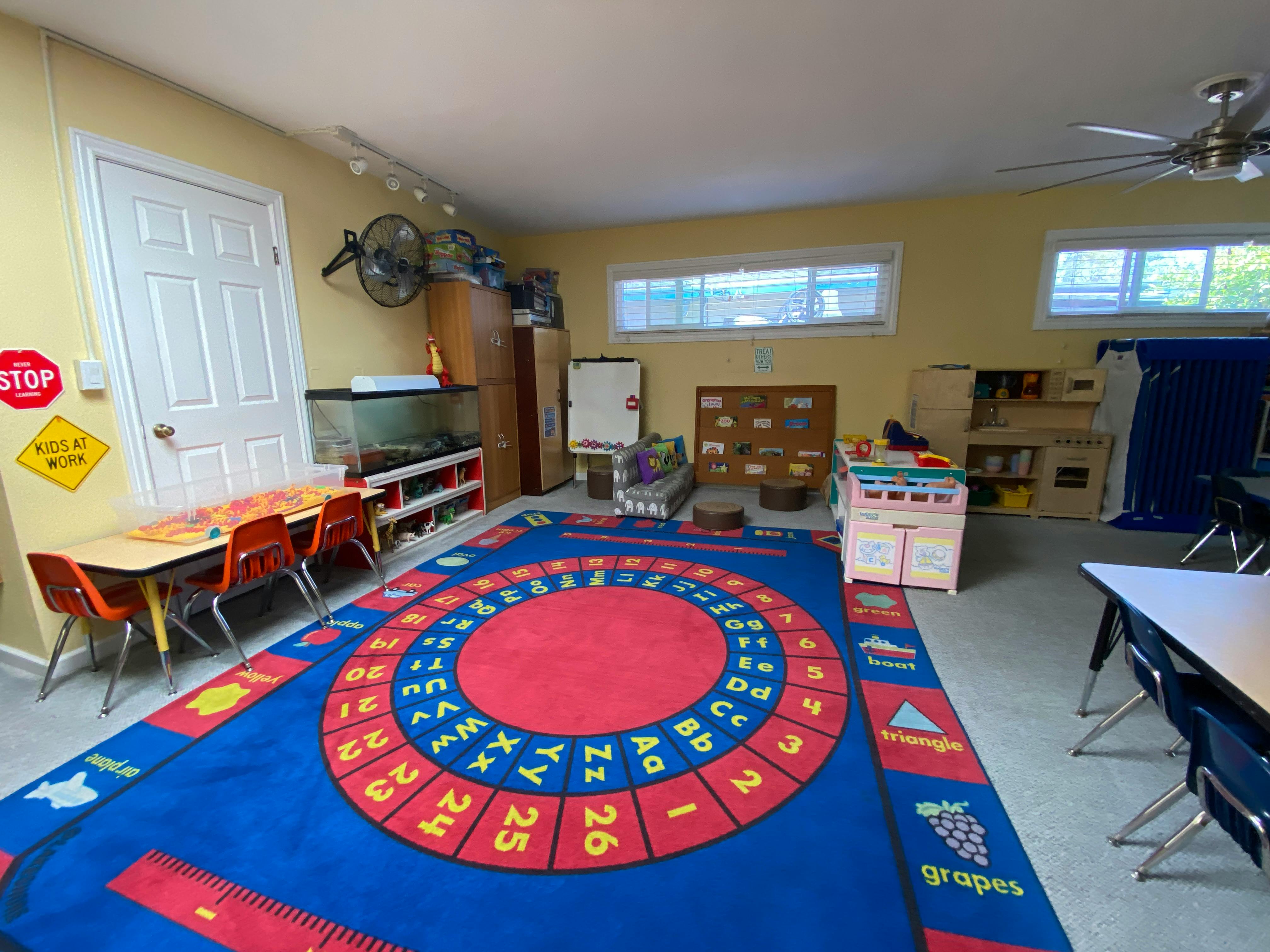 Classroom with a large alphabet and numbers rug