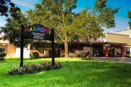 Harmony Early Learning Center sign in front of a building